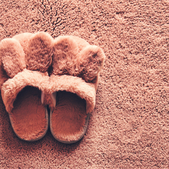 "Slippers over carpet" stock image