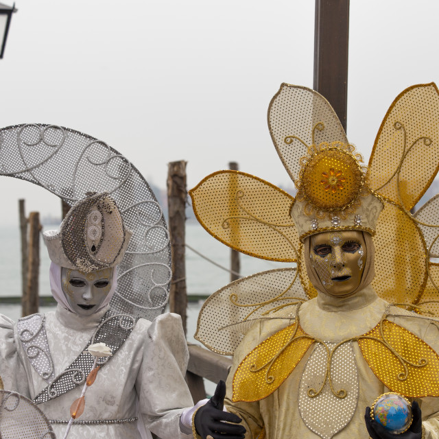 "Sun and Moon Costumes at Venice Carnival" by Bobb Strongman - £20.00 "Sun and Moon Costumes at Venice Carnival" stock image