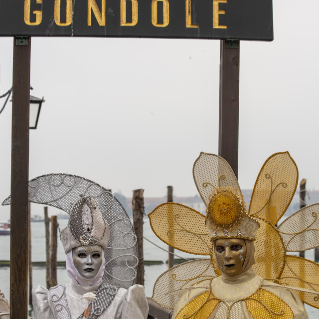 "Sun and Moon Costumes at Venice Carnival" by Bobb Strongman - £20.00 "Sun and Moon Costumes at Venice Carnival" stock image