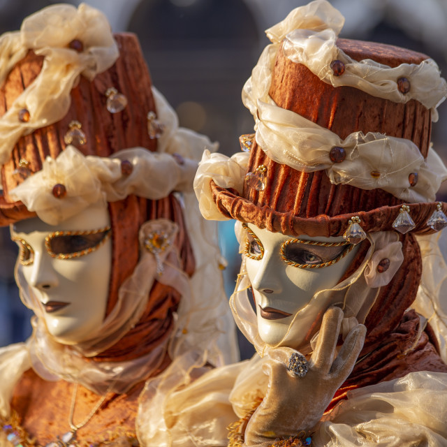 "Copper and Gold Costumes at Venice Carnival" by Bobb Strongman - £20.00 "Copper and Gold Costumes at Venice Carnival" stock image