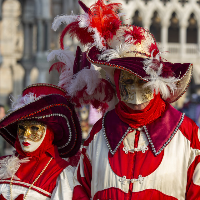"Red and White Costumes at Venice Carnival" by Bobb Strongman - £20.00 "Red and White Costumes at Venice Carnival" stock image