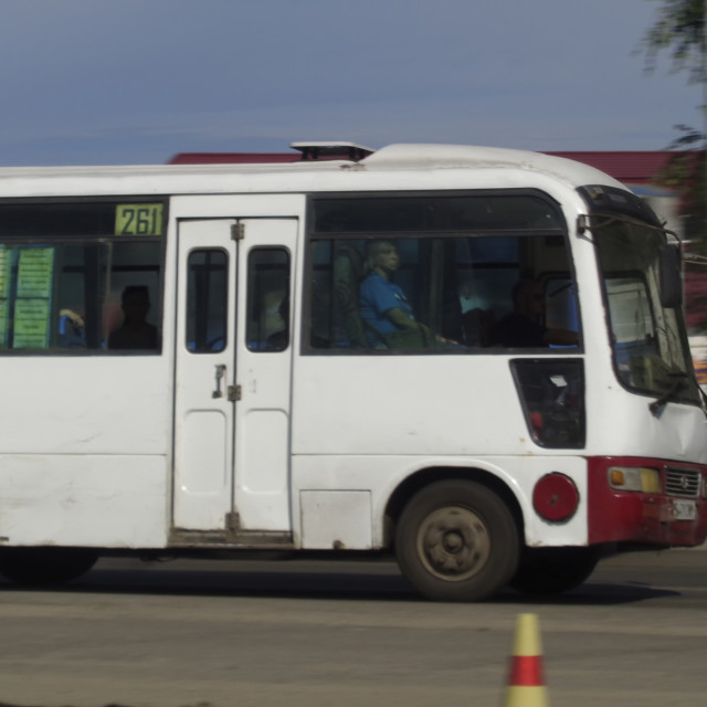 "Kazakhstan, Ust-Kamenogorsk, june 7, 2019: Small city bus on one of the city streets. Public transport. Motion" stock image