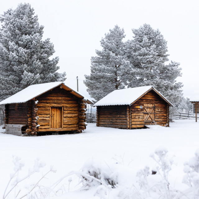 "Wooden cabins in the snow" stock image