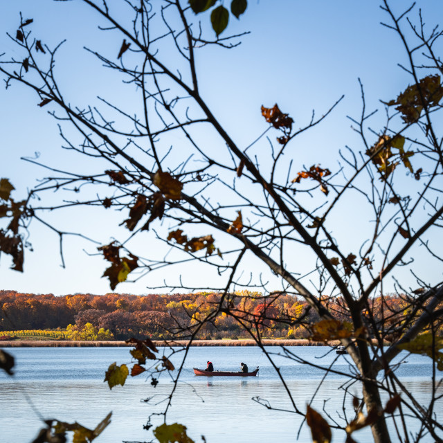 "fishing canoe on a minnesota lake" by Justin Mueller - £10.00 "fishing canoe on a minnesota lake" stock image