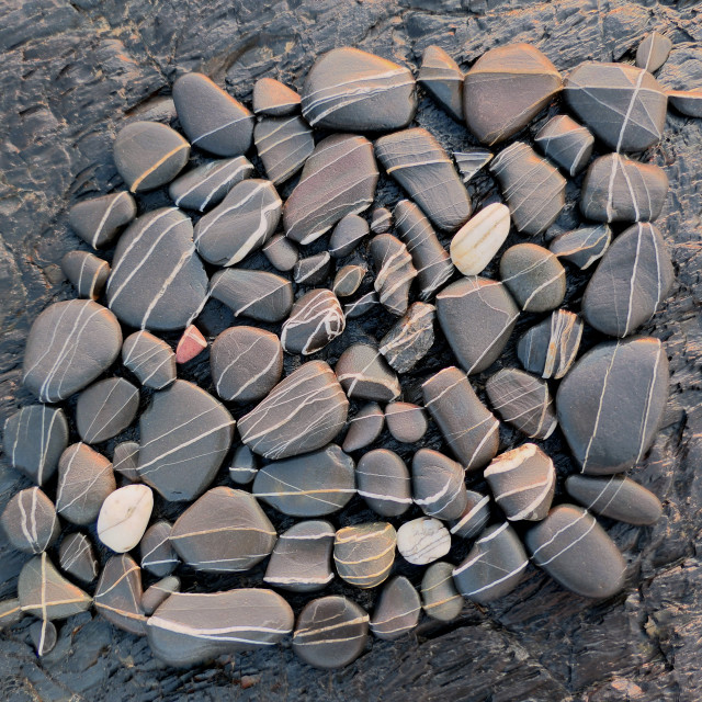 "Landart creation with beach pebbles" stock image