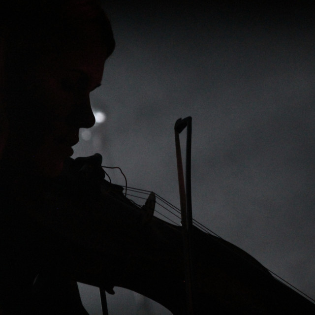 "Silhouette of Violin player" by Zachary I Peabody - £10.00 "Silhouette of Violin player" stock image