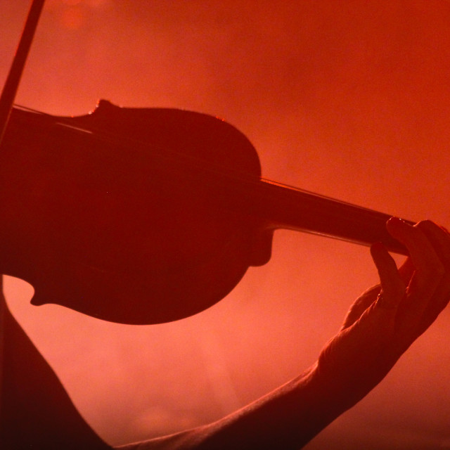 "Silhouette of Violin player" by Zachary I Peabody - £10.00 "Silhouette of Violin player" stock image