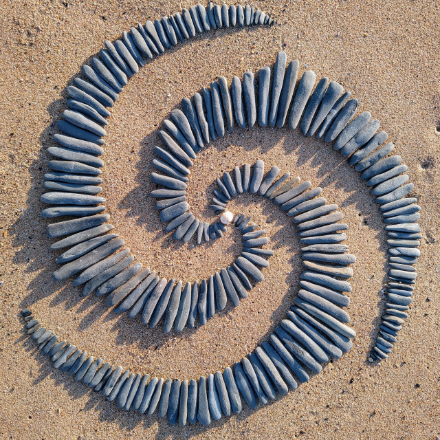 "Triple spiral of beach stones in Portugal" stock image