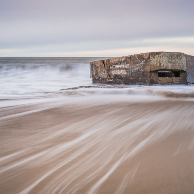 "Receding tide at the pillbox, Cayton Bay" stock image