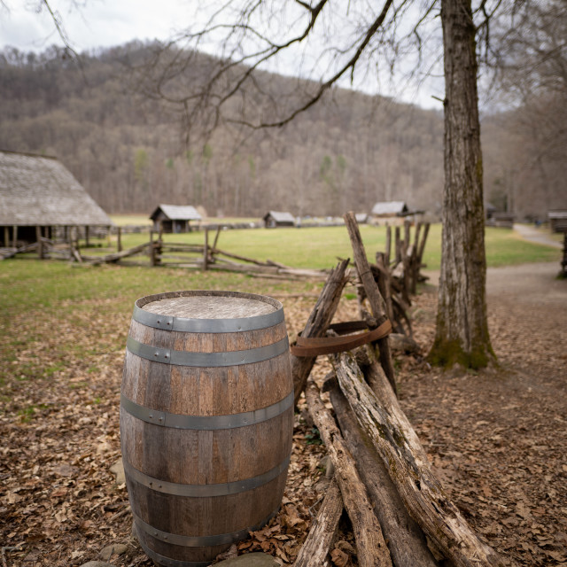 "barrel next to a rustic fence in a historic site" by Justin Mueller - £10.00 "barrel next to a rustic fence in a historic site" stock image