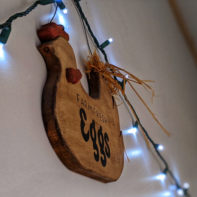 "Wooden chicken with string of lights" by MLLL Photography - $9.04 "Wooden chicken with string of lights" stock image