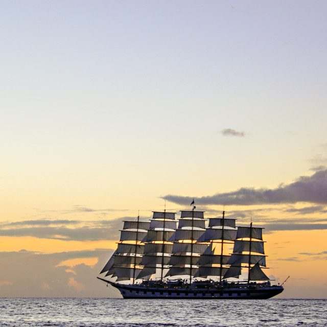 "A five-masted schooner sails at sunset in st. lucia." stock image