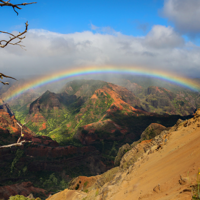 "A beautiful full rainbow with spectacular views of the Kalalau in Kauai, Hawaii, USA." stock image