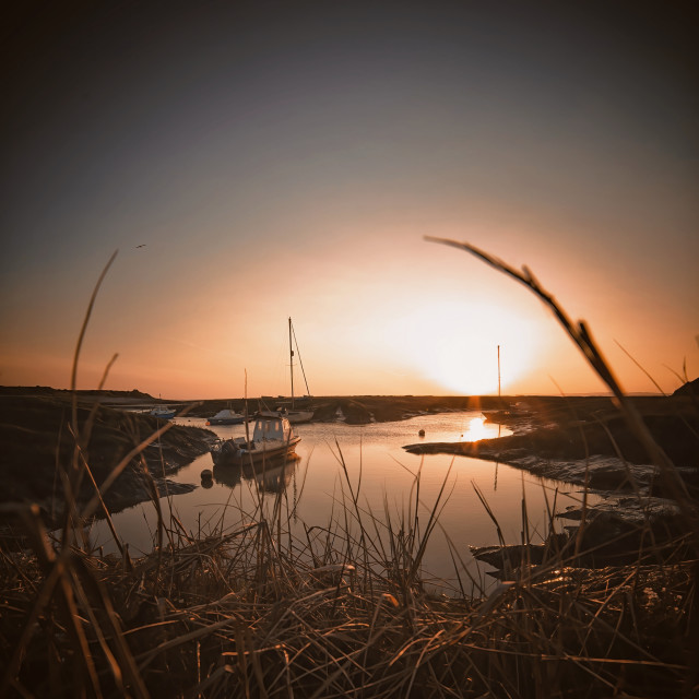 "Sunset over the boats" by Pete Griffiths - £10.00 "Sunset over the boats" stock image