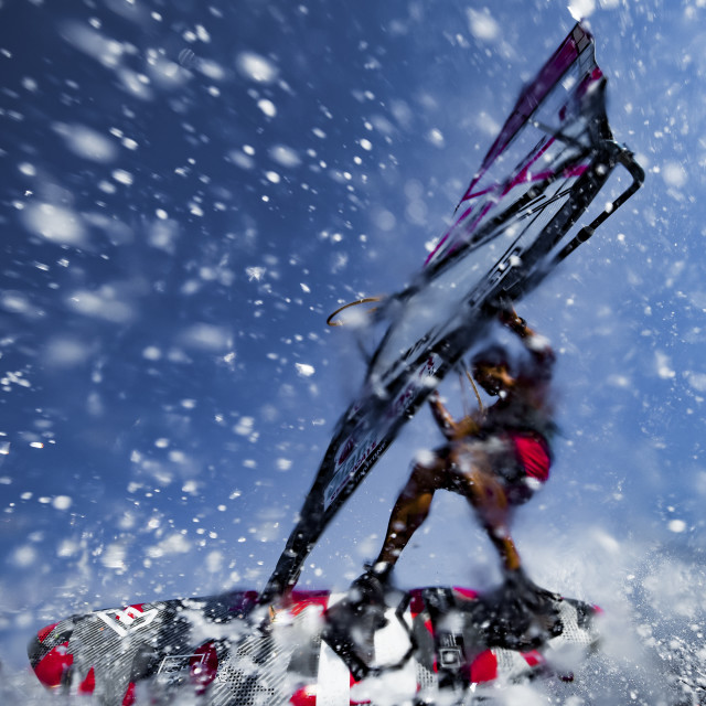 "Shooting a windsurfer in the desert" stock image