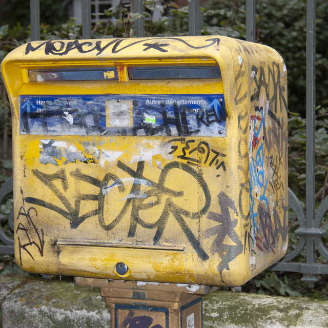 "Toulouse France Mail box covered in graffiti." stock image