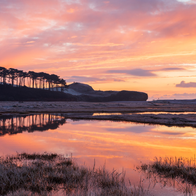 "Fiery Sunrise at Budleigh Salterton" by Bruce Little - £20.00 "Fiery Sunrise at Budleigh Salterton" stock image