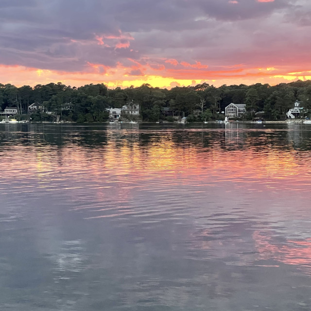 "Sunset over water" stock image