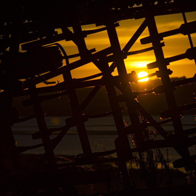 "Sunrise Through a Harvester, Ardullie, Scottish Highlands" by John McGowan - £10.00 "Sunrise Through a Harvester, Ardullie, Scottish Highlands" stock image