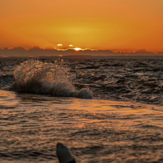 "Waves at Sunset" by Pete Griffiths - £10.00 "Waves at Sunset" stock image
