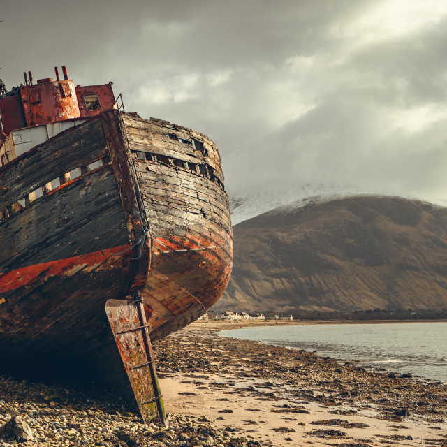 "The Old Boat of Caol And Ben Nevis In The Scottish Highlands" stock image