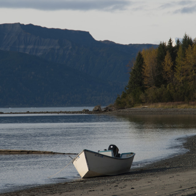 "Fishing skiff on beach." stock image