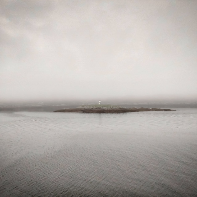 "Lighthouse in the fog, Isle of Harris." stock image