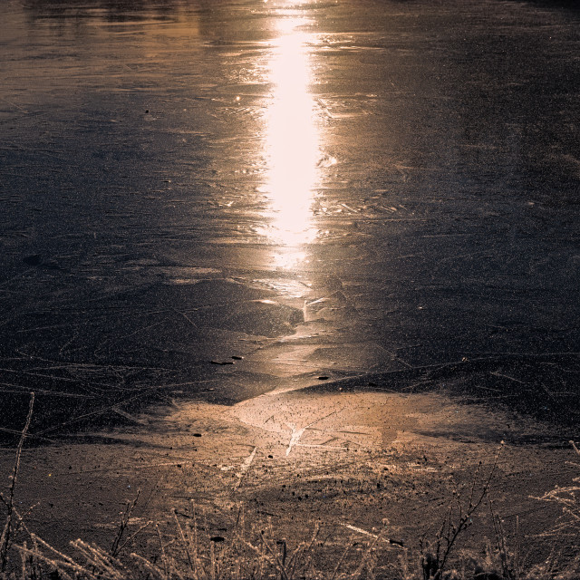 "Sunlight reflection on frozen lake" stock image