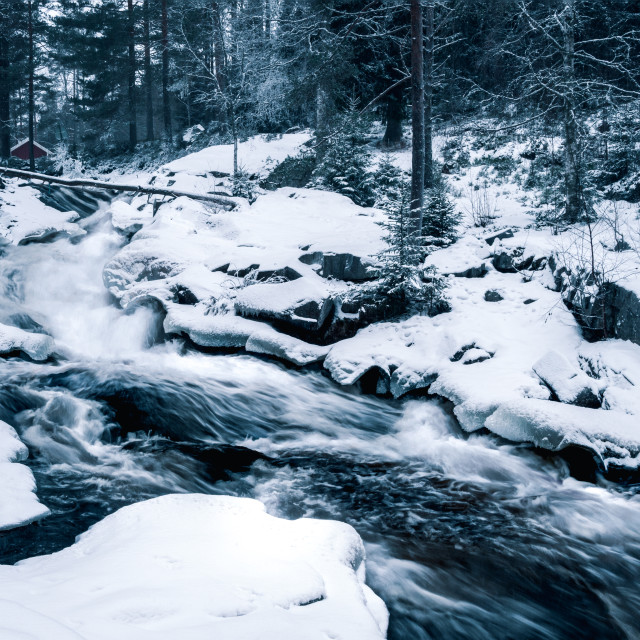 "Roaring waterfall among the snow" stock image