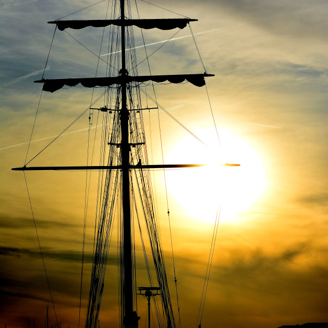 "Masts ship in the sunset" by Amit Mendelsohn - £50.00 "Masts ship in the sunset" stock image