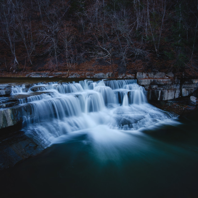 "A silky-smooth long exposure of one of the waterfalls at Taughannock Falls State Park, NY, USA, photographed on a cold December day with wintry light" stock image