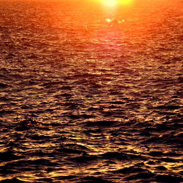 "Sea reddened by the sunset" by Amit Mendelsohn - £50.00 "Sea reddened by the sunset" stock image