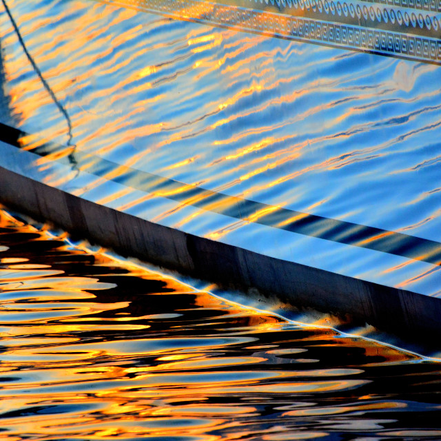 "Sunset reflecting on boat" by Amit Mendelsohn - $49.80 "Sunset reflecting on boat" stock image
