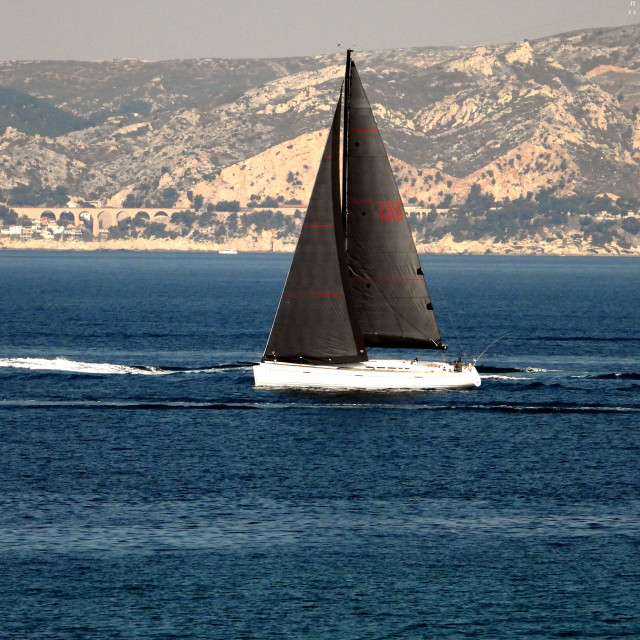 "A black sail boat" by Amit Mendelsohn - £50.00 "A black sail boat" stock image