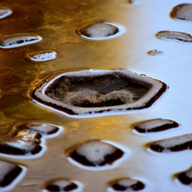 "Water on a manhole" by Amit Mendelsohn - £50.00 "Water on a manhole" stock image