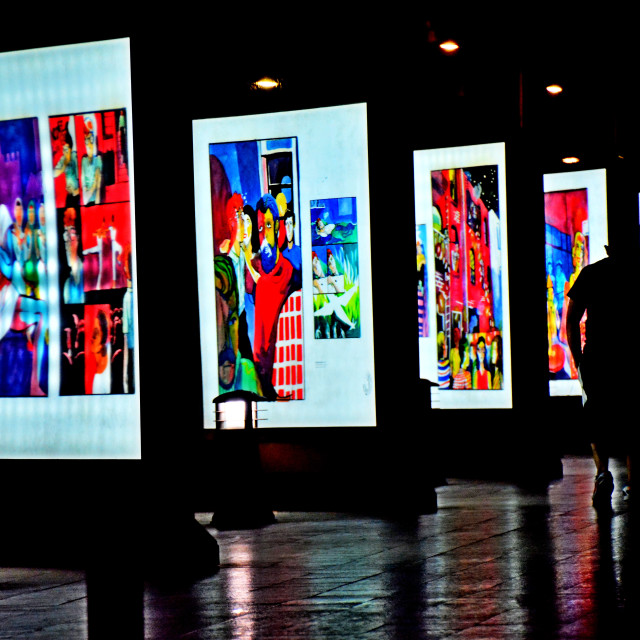 "A man walk by an exhibition" by Amit Mendelsohn - $49.80 "A man walk by an exhibition" stock image