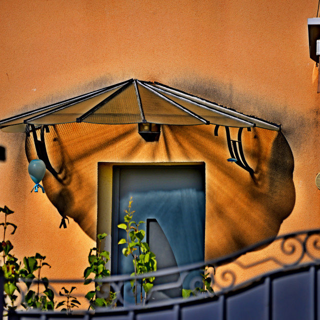 "Sun shader on a door" by Amit Mendelsohn - £50.00 "Sun shader on a door" stock image