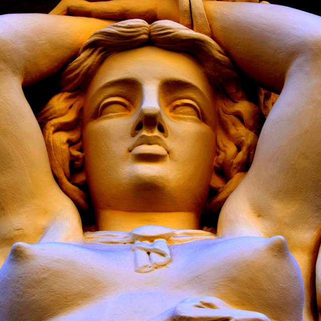 "A statue under a balcony" by Amit Mendelsohn - £50.00 "A statue under a balcony" stock image