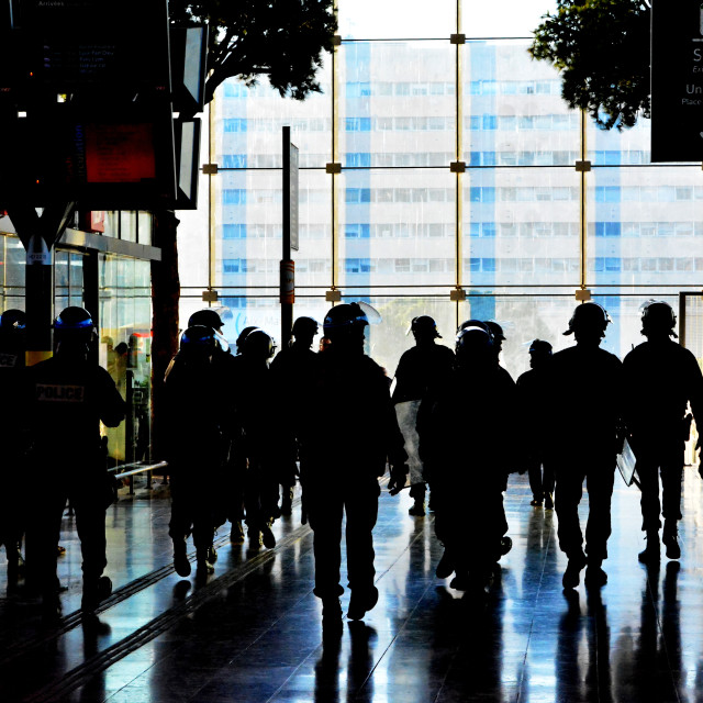"A group of policemen in A chase" by Amit Mendelsohn - £50.00 "A group of policemen in A chase" stock image