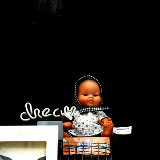 "A doll of a baby" by Amit Mendelsohn - £50.00 "A doll of a baby" stock image
