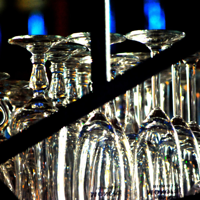 "Glasses in a bar" by Amit Mendelsohn - £50.00 "Glasses in a bar" stock image
