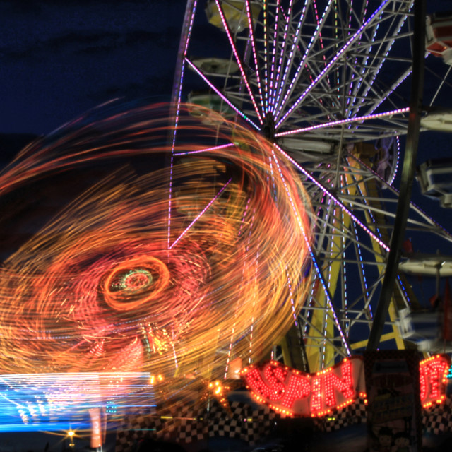 "Ferris Wheel and Spinning Ride" by TGM Reynolds - £10.00 "Ferris Wheel and Spinning Ride" stock image