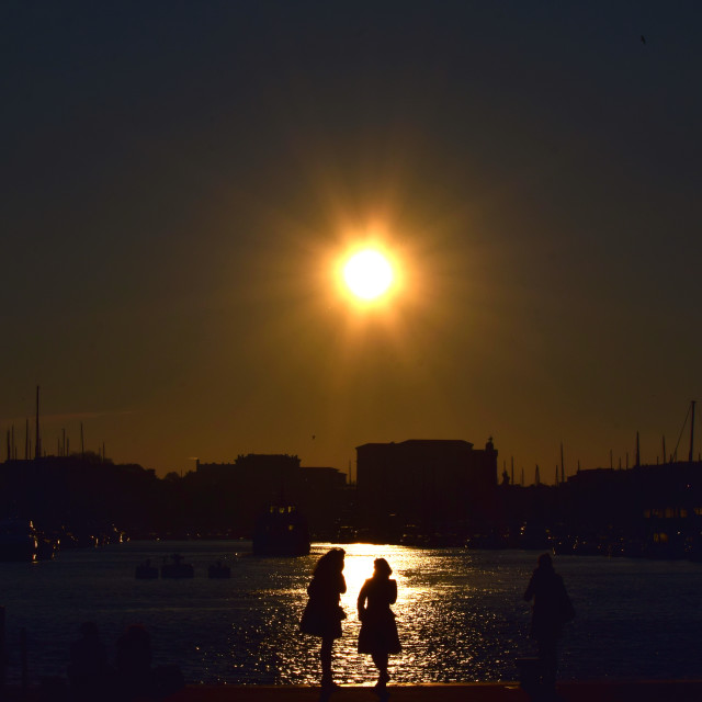 "2 women in the sunset" stock image