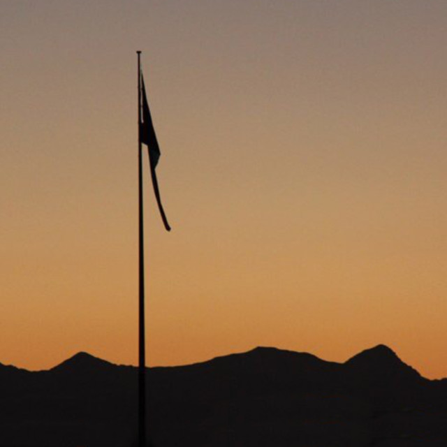 "A Flag at Dusk" stock image