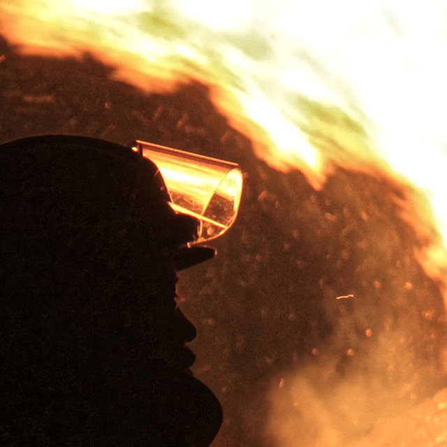 "Fireman Watches a Bonfire" by TGM Reynolds - £10.00 "Fireman Watches a Bonfire" stock image