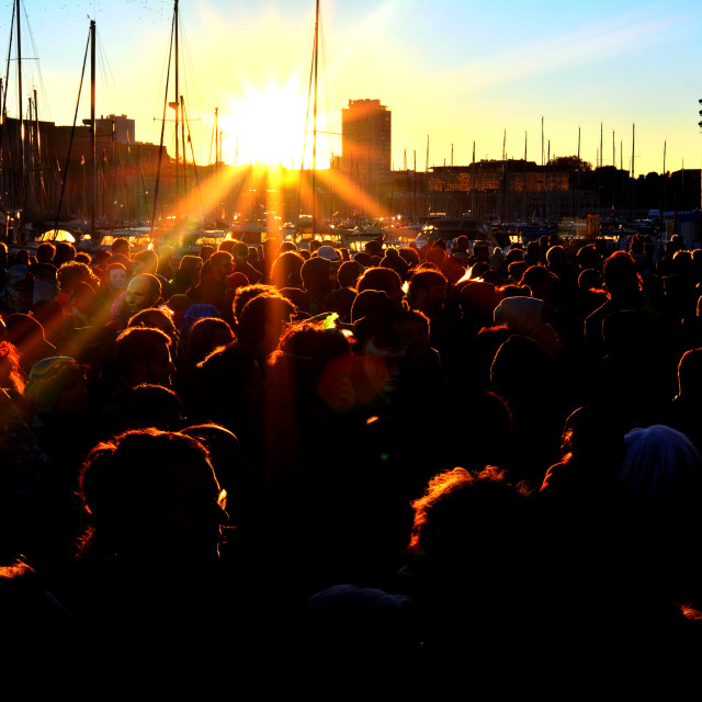 "Crowd in the sunset" stock image