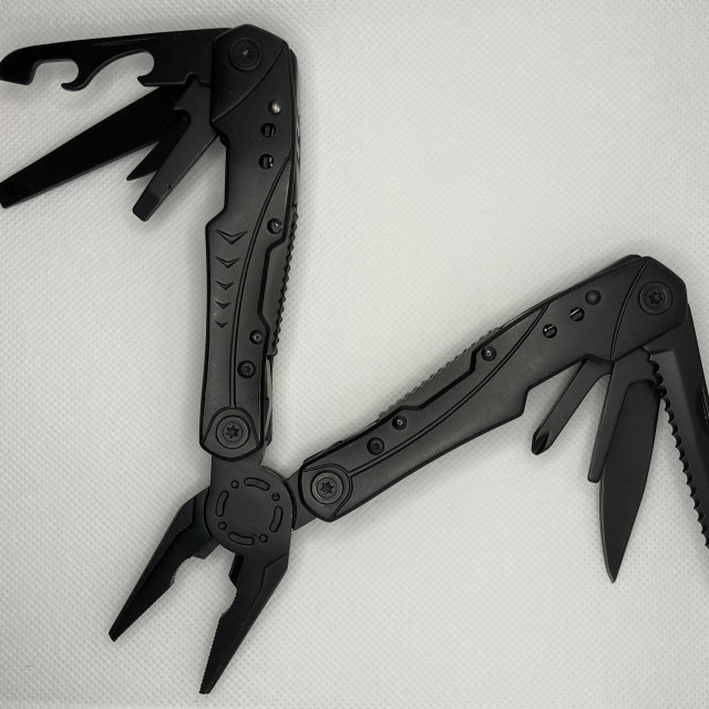 "Black Multi-tool with Tools Extended" by TGM Reynolds - £10.00 "Black Multi-tool with Tools Extended" stock image