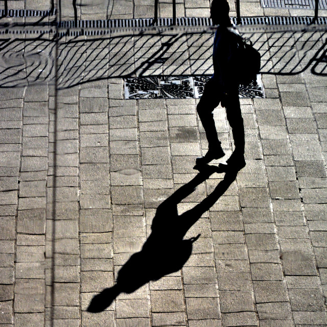 "A man and his shadow" by Amit Mendelsohn - £50.00 "A man and his shadow" stock image
