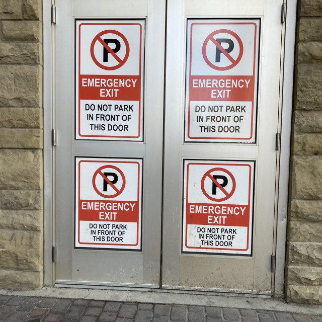 "Emergency Exit Warning Signs" by TGM Reynolds - £10.00 "Emergency Exit Warning Signs" stock image