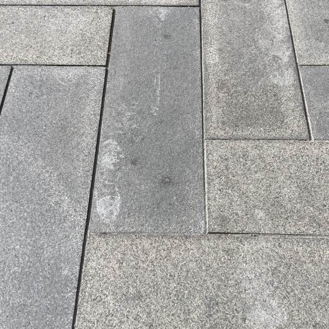 "Shoe Print on a Stone Sidewalk" by TGM Reynolds - £10.00 "Shoe Print on a Stone Sidewalk" stock image